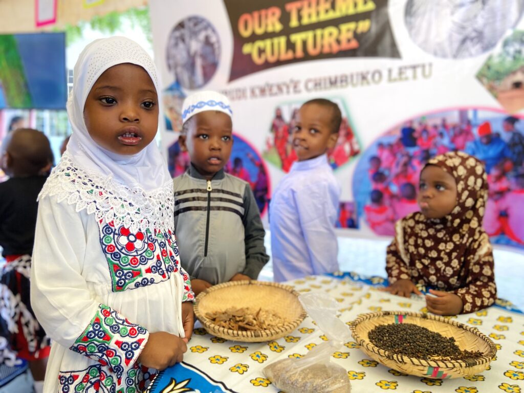 Cultural attire and local grains on show beneath the theme banner.