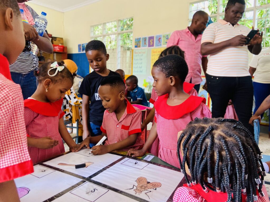 Parents capture the moment as learners work through matching exercises.