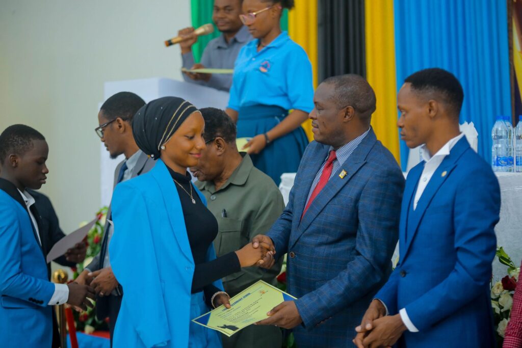 Receiving a leaving certificate from the guest of honour