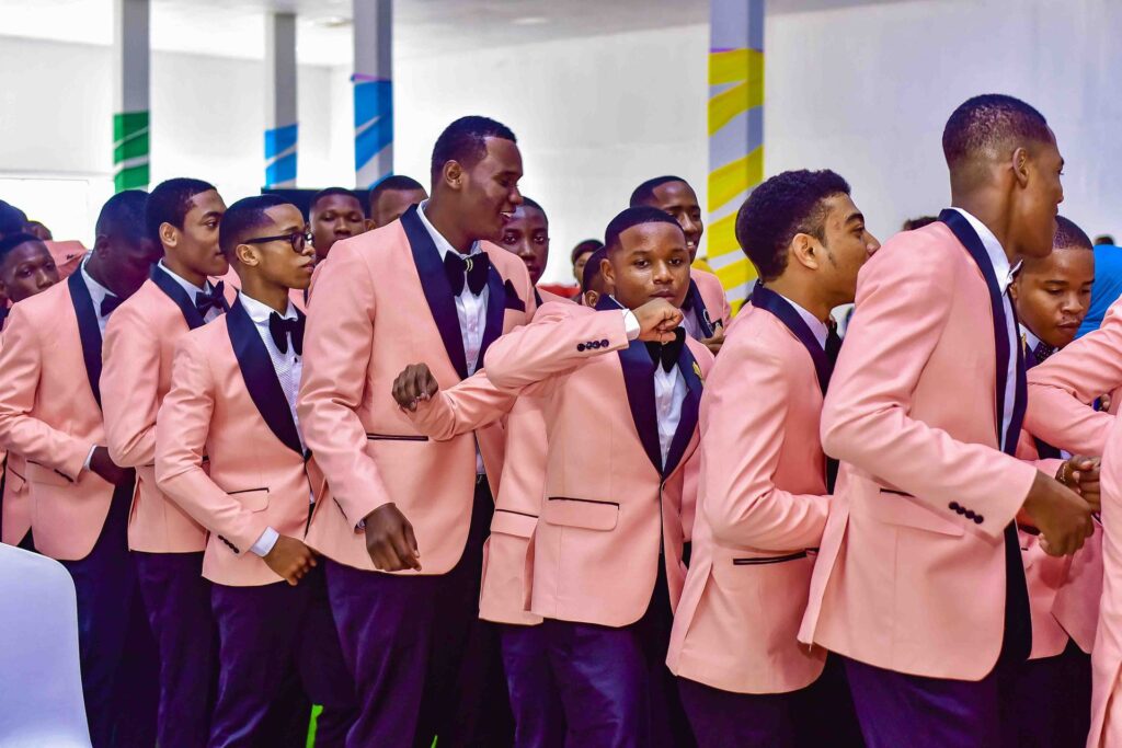 The boys bring the energy in their graduation tuxedos
