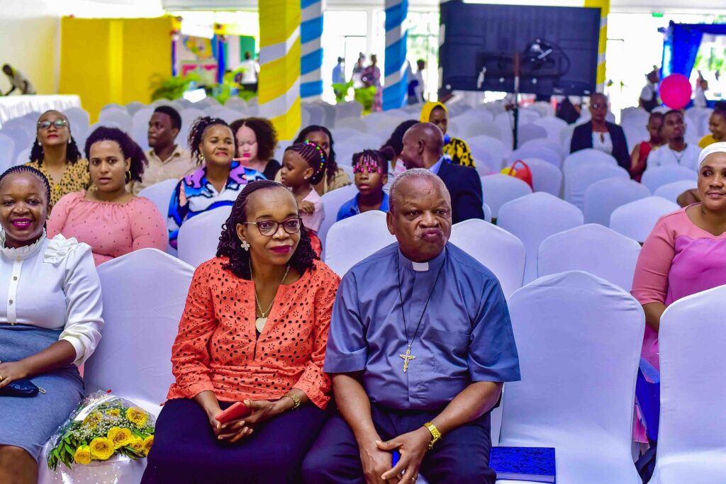 Honoured guests and family members take their seats