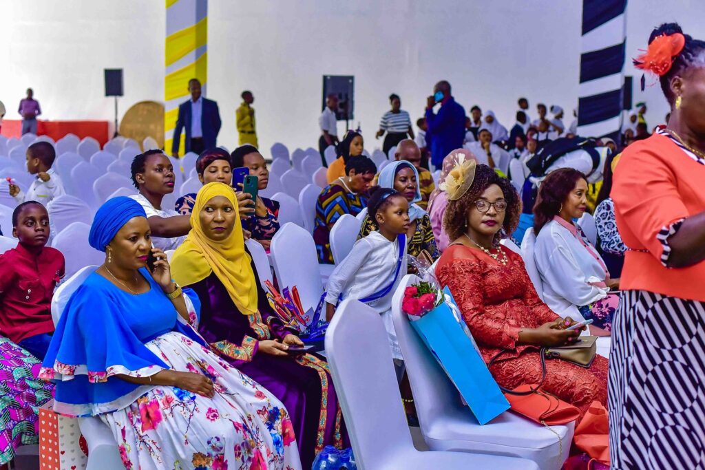 Families dressed for the occasion fill the hall