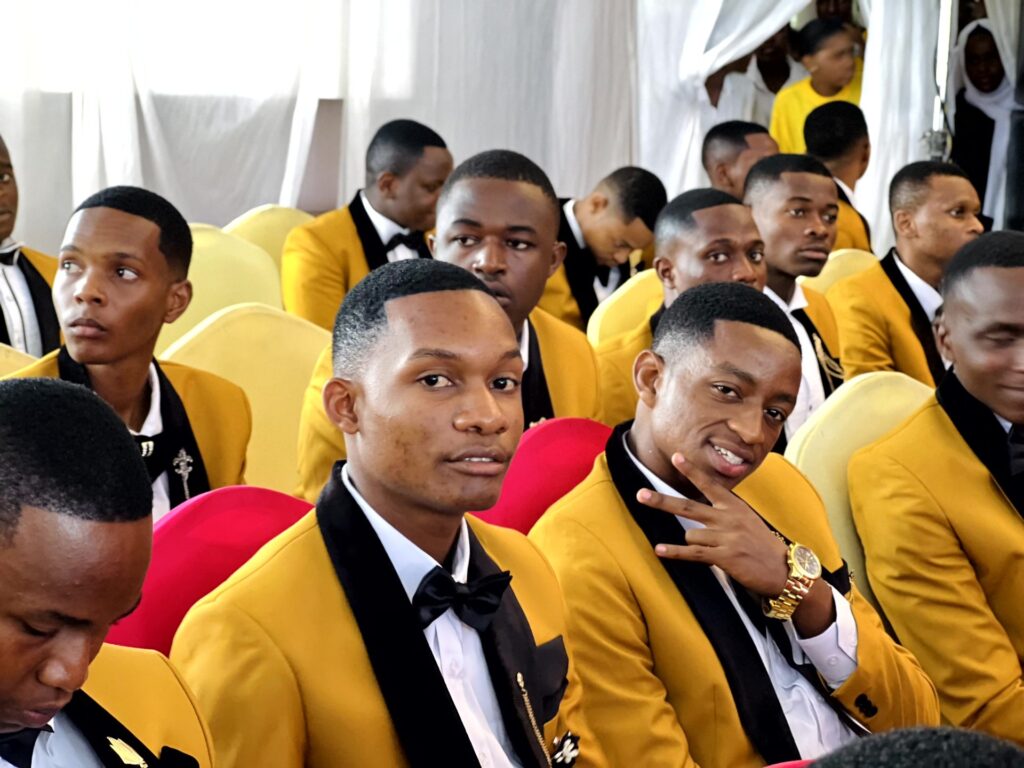 Bright faces in the crowd as the ceremony gets underway