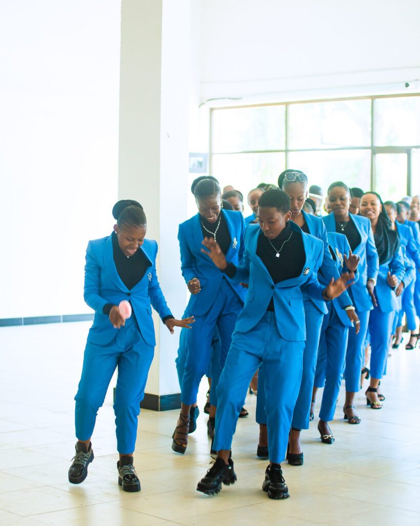 Graduates dance their way into the hall as the procession begins.