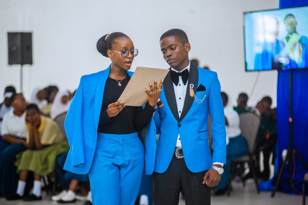 The masters of ceremony guide the programme.
