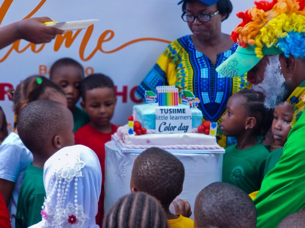 Gathered round the Colour Day cake