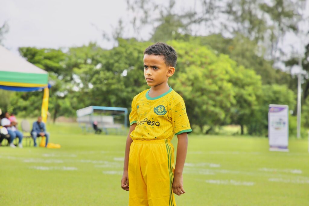 A young striker sizes up the goal