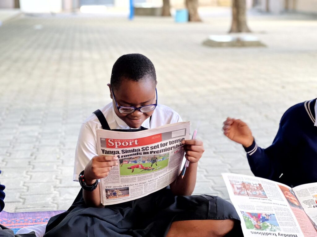 Catching up on the sports pages.