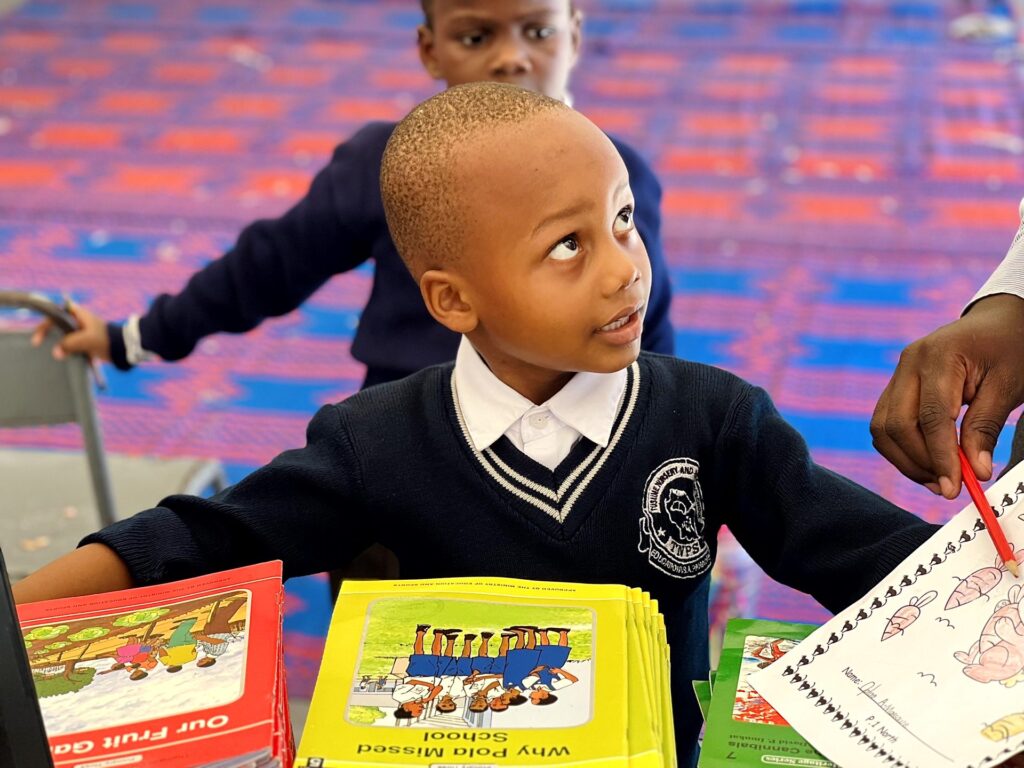 Choosing a favourite from the picture-book table.