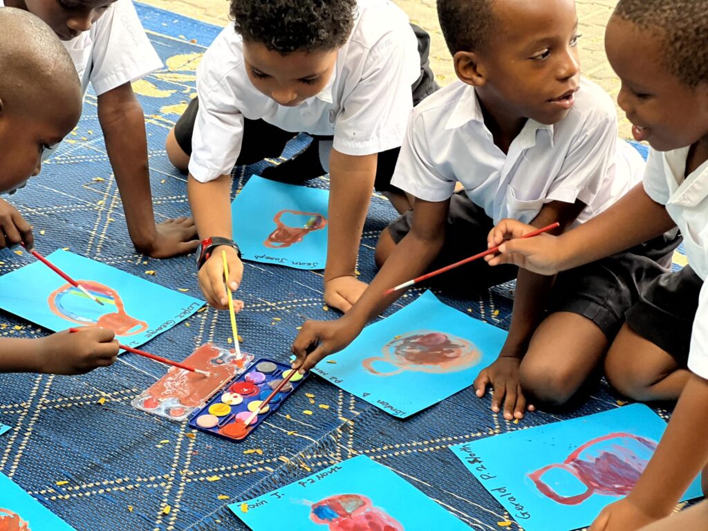 Sharing the watercolours at the art session.
