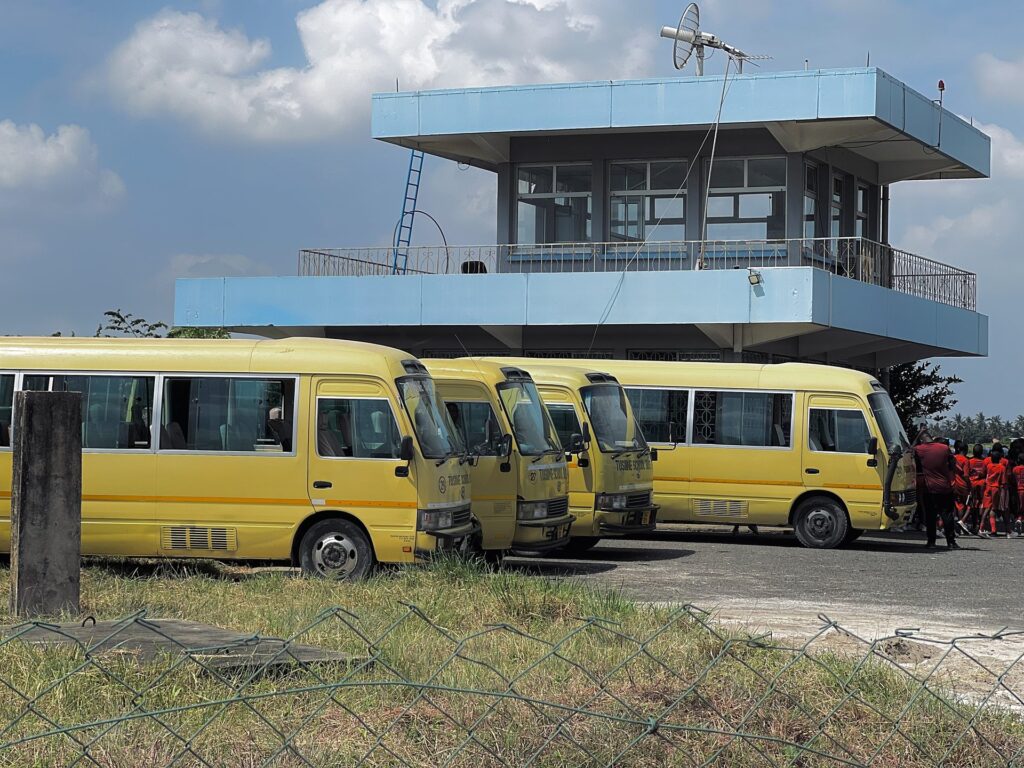 Our buses arrive beneath the control tower