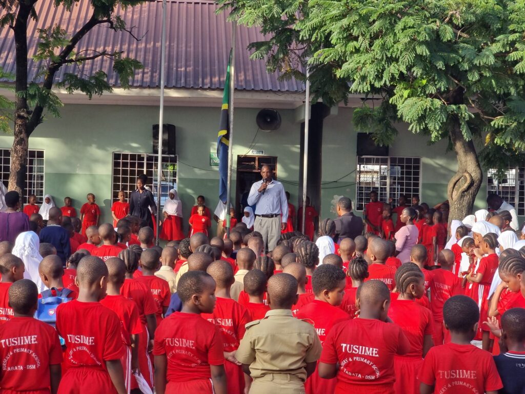 Morning assembly beside the flagpole.