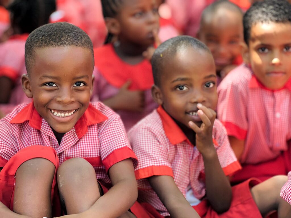Bright smiles on the playground.