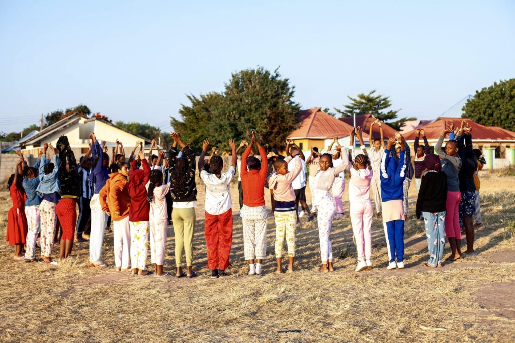 Sunrise stretches - morning exercises at camp.